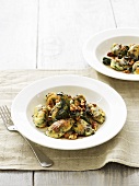 Spinach gnocchi with sage, butter sauce and walnuts