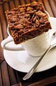 Chocolate square on coffee cup