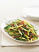 Green and yellow beans with chopped bacon and garlic