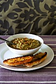 Aubergine and garlic dip with pine nuts, toasted bread