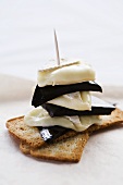 Brie with grape jelly on Melba toast