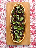 Flatbread topped with caramelised onions, chilli, chorizo and olives