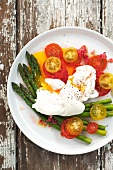 Tomato and asparagus salad with poached eggs