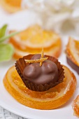 Orange and nut chocolate on candied orange slice