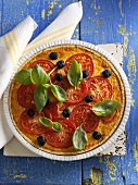 Tomato quiche with olives and basil