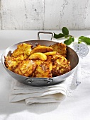 Apple and potato rösti in frying pan