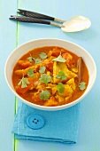 Cod and tomato curry with coriander leaves