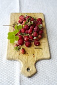 Woodland strawberries on a wooden board