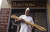 Italian baker with hand-made grissini, Barolo