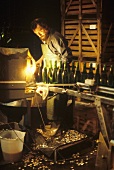 Degorgement: removing the sediment from sparkling wine