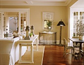 Pale living-dining room in white and natural shades with vintage, country-house-style decor