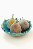 Three figs in a bowl