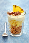 A layered dessert with cornflakes, pineapple and yogurt