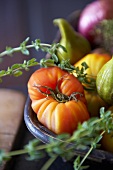 Tomatoes, figs and thyme in a bowl