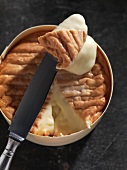 Epoisses (soft cheese from France) in wooden packaging