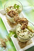 Chicken kebabs with sesame seeds and an avocado dip