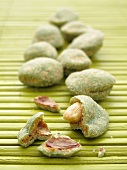Wasabi peanuts on a bamboo mat