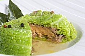 Stuffed savoy cabbage with foie gras, peppercorns and bay leaves