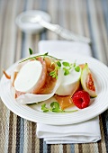 Goats' cream cheese with prosciutto, figs and raspberries