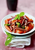 Strawberry salad with duck breast strips