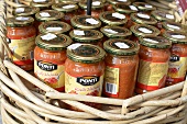 Bolognese sauce in jars at a market