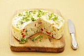 Savory cheesecake with vegetables, herbs and cress