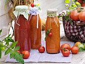 Bottles of home-made tomato pesto, tomatoes