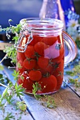 Bottled cherry tomatoes in preserving jar