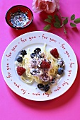 Ribbon pasta with berries and soft cheese