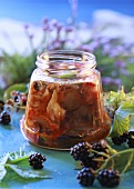 Pickled forest mushroom salad in screw-top jar