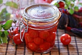 Bottled cherry tomatoes in preserving jar