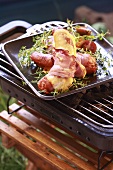 Barbecued sausages with cheese and ham