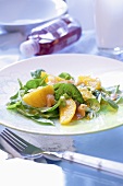 Spinach and orange salad with smoked fish