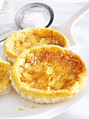 Puff pastry tart shells with candied lemon peel and icing sugar