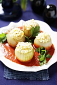 Onions with egg stuffing in tomato sauce