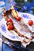 Trout with rosemary and cherry tomatoes in foil