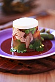 Meat and peas in aspic with horseradish