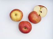 Apples (variety 'Fuji'), whole and halved