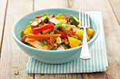 Pork with rice, pineapple, carrots, peppers and courgettes