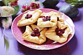 Curd cheese turnovers with cherries