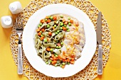 Chicken breast in orange sauce, ribbon pasta and vegetables