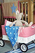 Plush bunny & blanket in toy pram