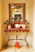Wall table with Christmas decorations, mirror