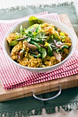 Spicy rice with chicken breast, turmeric, coriander and spinach