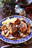 Rabbit with plums, apricots and rice