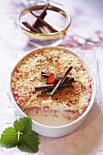 Baked rice pudding with strawberries and cinnamon