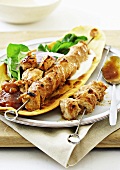 Spicy chicken kebabs on naan bread