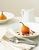 Poached pear on custard