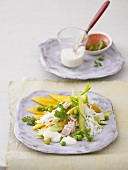 Rice salad with mango, ham and peas