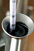 Measuring the alcohol during schnapps distillation with an areometer